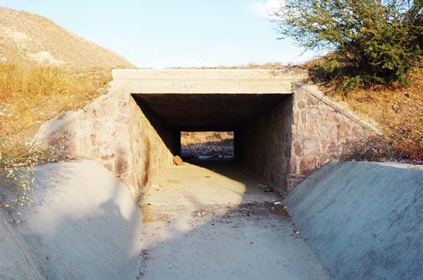 A rectangular stone-masonry culvert.