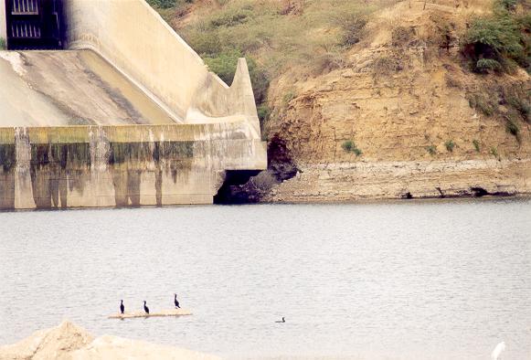 Close-up of ski-jump spillway at Poechos Dam, showing erosion damage 