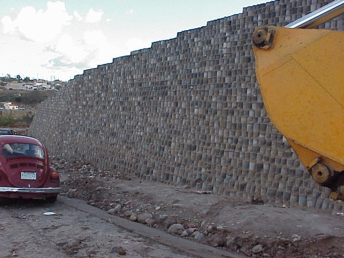 Side view of retaining wall built with discarded tires