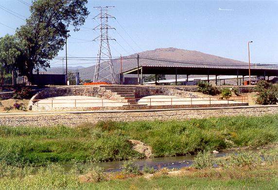 View of the right bank, showing skateboard rinks.